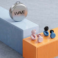 Wave Pro earplugs lifestyle photo - smart noise filtering earplugs worn at concerts and during travel India