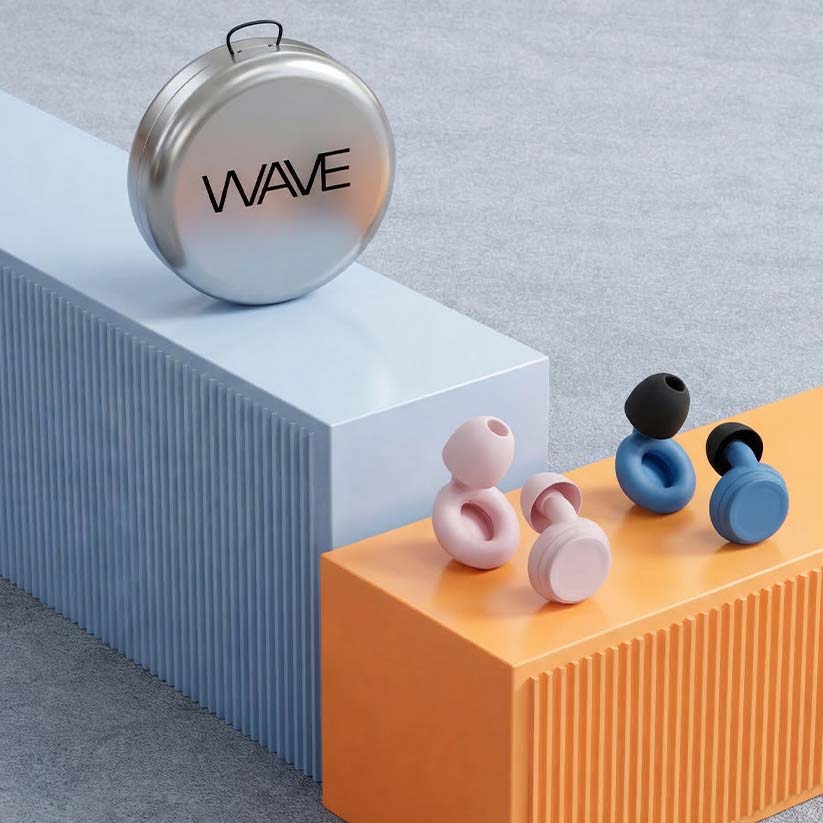 Wave Pro earplugs lifestyle photo - smart noise filtering earplugs worn at concerts and during travel India
